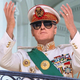 Clinton greets his subjects from a White House balcony.